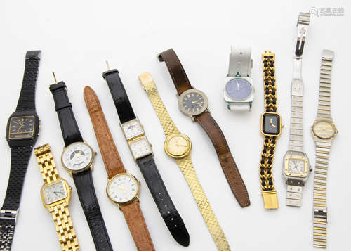 A collection of ladies wristwatches, including a gold plated and black Chanel example, a gold plated