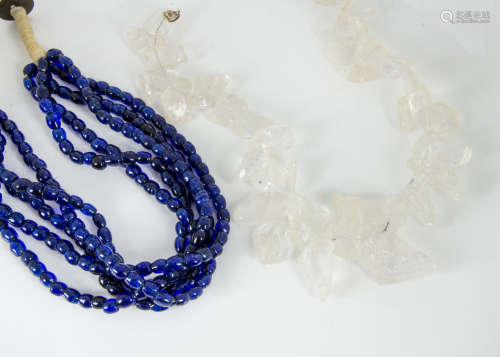 A large contemporary rock crystal neckalce, with silver snap clasp, 51cm and a blue glass bead multi