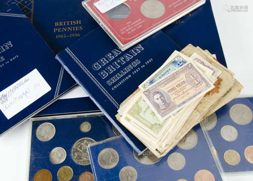 A collection of coins, in albums and folders, and also some loose in plastic pockets, varying from