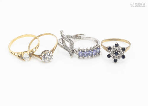 Five gold gem set dress rings, including three in yellow gold and two in white, set with diamonds,
