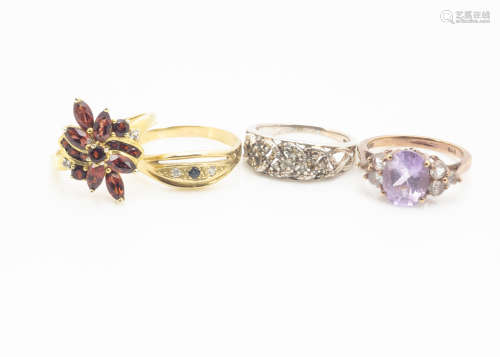 A sapphire and diamond yellow metal ring, af, together with two karis gem set dress rings, and a