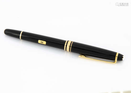 A modern Mont Blanc Meisterstuck fountain pen, black with gold mounts, two tone 14ct gold nib marked