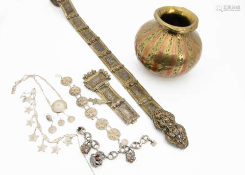 A collection of Middle Eastern and Egyptian jewels, including a silver and silver gilt niello work