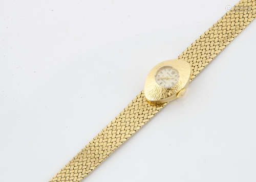 A c1970s Rolex 18ct gold lady's wristwatch, 12mm wide oval textured case, appears to run, with