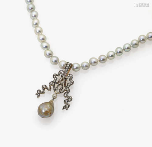 A Cultured Pearl Necklace with Bow-Shaped Pendant