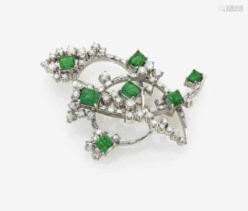 A Diamond and Emerald Brooch