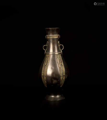 A BRONZE BEAST PATTERN VASE銅饕餮紋獸耳筒瓶 17-18世紀