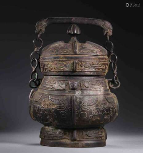 A Chinese Bronze Hoop-handled Kettle