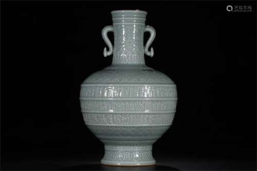 A Chinese Celadon Glazed Carved Porcelain Zun