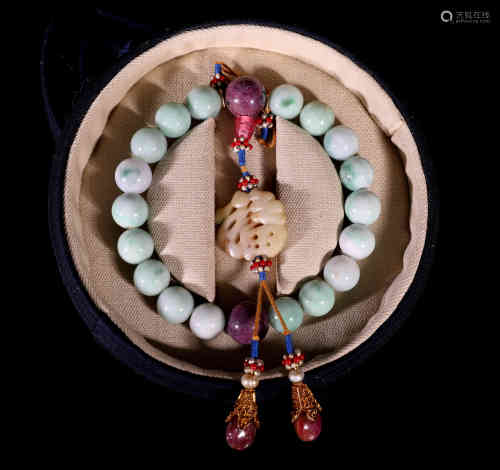 A Chinese Bracelet of 18 Jadeite Balls