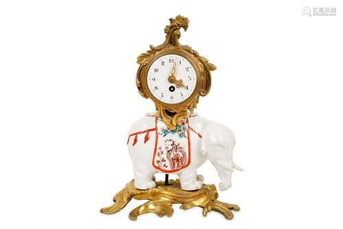 AN EARLY 20TH CENTURY FRENCH ORMOLU MOUNTED SAMSON PORCELAIN ELEPHANT MANTEL CLOCK modelled as a