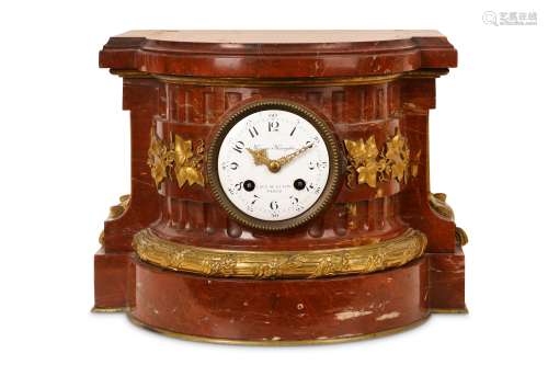A THIRD QUARTER 19TH CENTURY FRENCH ROUGE MARBLE AND GILT BRONZE MOUNTED MANTEL CLOCK BY MAISON