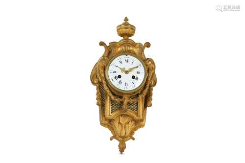 A MID 19TH CENTURY FRENCH LOUIS XVI STYLE GILT BRONZE CARTEL CLOCK surmounted by an urn with