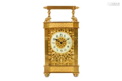 A LATE 19TH / EARLY 20TH CENTURY FRENCH GILT BRASS CARRIAGE CLOCK the case with fluted columns and