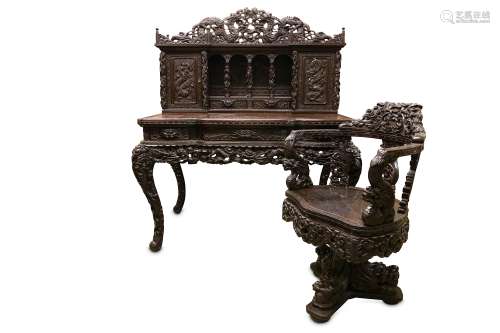 A FINE LATE 19TH CENTURY MEIJI PERIOD JAPANESE EXPORT CARVED HARDWOOD DESK AND CHAIR EXHIBITED AT