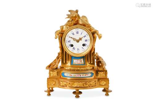 A MID 19TH CENTURY FRENCH GILT BRONZE AND PORCELAIN MOUNTED MANTEL CLOCK the arched case topped with