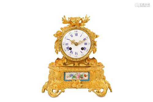 A MID 19TH CENTURY FRENCH GILT BRONZE AND PORCELAIN MOUNTED MANTEL CLOCK the drum case surmounted