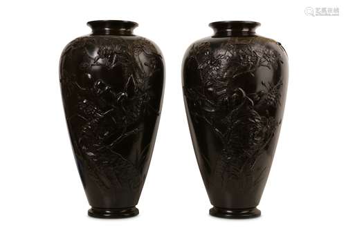 A PAIR OF LATE 19TH CENTURY JAPANESE MEIJI PERIOD BRONZE VASES of baluster form, decorated in relief