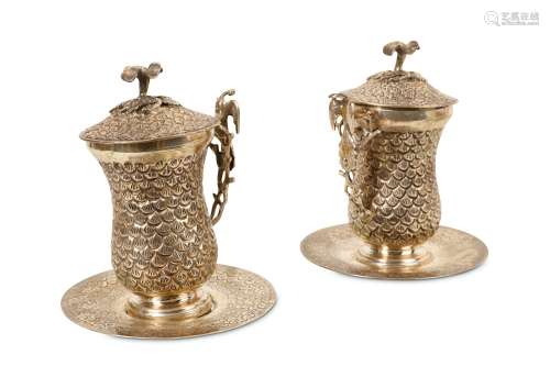 A PAIR OF EGYPTIAN SILVER SAHLEP CUPS decorated with a fish scale design throughout, the domed