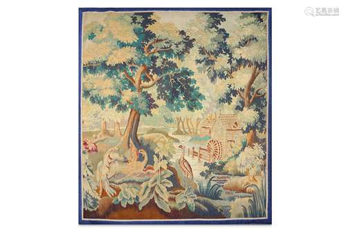 A 19TH CENTURY VERDURE TAPESTRY DEPICTING A WOODED MILL SCENE WITH STORKS depicting a mill