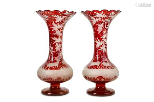A PAIR OF 19TH CENTURY BOHEMIAN RUBY GLASS VASES the long slender necks with everted, scallop-