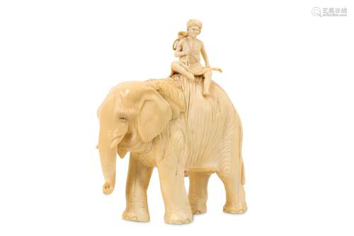 A 19TH CENTURY ANGLO-INDIAN CARVED IVORY MODEL OF AN ELEPHANT AND RIDER the rider carrying an urn
