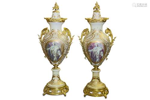 A LARGE PAIR OF LOUIS XVI STYLE PORCELAIN AND GILT METAL VASES of baluster form with domed covers