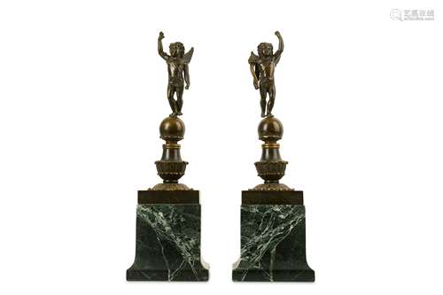 A PAIR OF 19TH CENTURY FRENCH EMPIRE STYLE BRONZE FIGURES OF PUTTI the winged cherubs with long