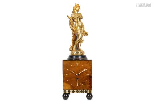 AN ART DECO STYLE BURR WALNUT AND GILT METAL CONICAL PENDULUM MYSTERY CLOCK the late 19th century