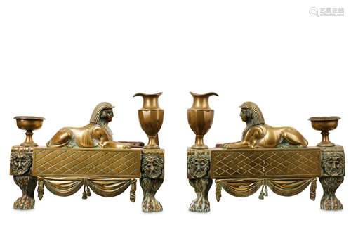 A PAIR OF EARLY 19TH CENTURY REGENCY BRONZE CHENETS CAST WITH SPHINXES, IN THE STYLE OF THOMAS