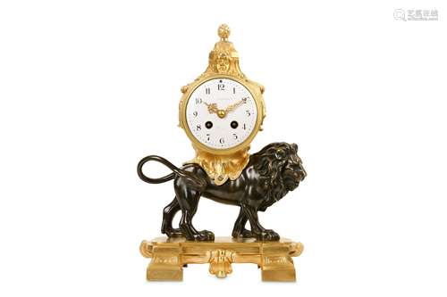 A LATE 19TH CENTURY FRENCH GILT AND PATINATED BRONZE MANTEL CLOCK MODELLED WITH A LION in the