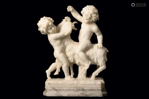 A 19TH CENTURY ITALIAN CARRARA MARBLE GROUP OF TWO PUTTI WITH A GOAT the Bacchic cherub holding