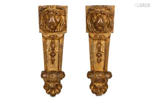 A PAIR OF 19TH CENTURY ITALIAN GILTWOOD LION MASK WALL MOUNTS each lion mask carved above a tapering