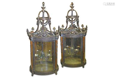 A VERY LARGE PAIR OF REGENCY STYLE BRONZE HALL LANTERNS of cylindrical form, the domed coronas