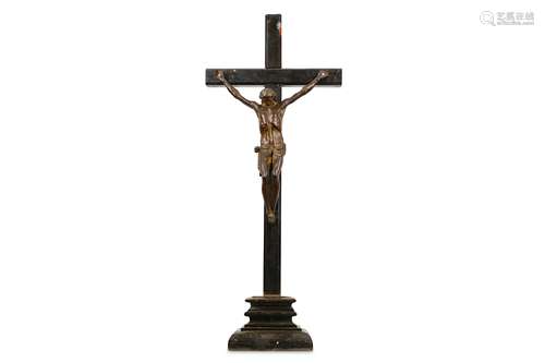 A 19TH CENTURY BRONZE CORPUS CHRISTI ON EBONISED CRUCIFIX wearing a rope tied perizonium, traces