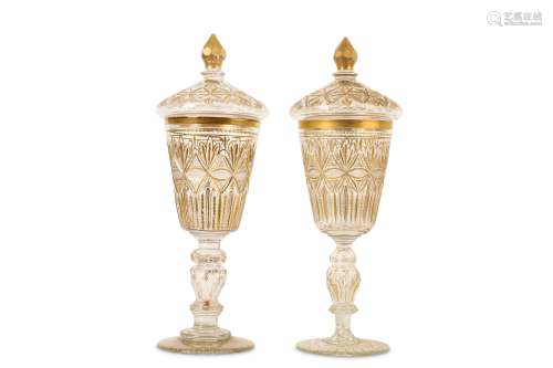 A PAIR OF 19TH CENTURY TURKISH OTTOMAN BEYKOZ GLASS GOBLETS AND COVERS the cut and gilded glass