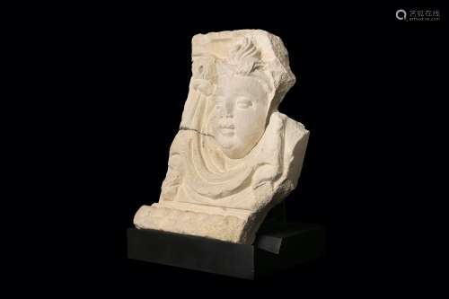 A 17TH CENTURY ITALIAN SANDSTONE RELIEF OF A PUTTO, TUSCAN the putto mask flanked by drapery with a