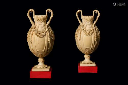 A FINE PAIR OF 19TH CENTURY DIEPPE IVORY VASES the baluster vases on circular feet over square