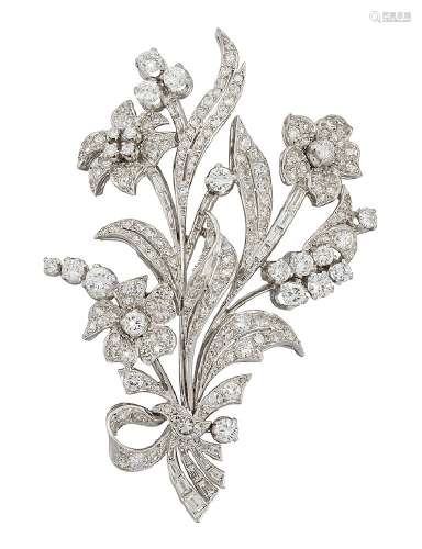 A diamond floral spray brooch, set throughout with brilliant, baguette and single-cut diamonds, with