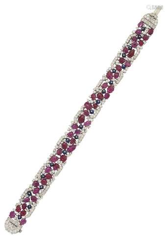 A ruby, sapphire and diamond bracelet, the openwork flexible bracelet composed of a series of leaf