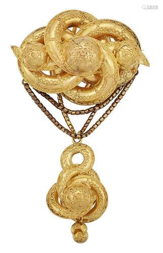 A mid 19th century gold brooch, the scrolling quatrefoil top with graduated boss accents and applied