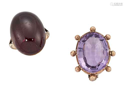 A 19th century garnet ring and amethyst brooch, the closed-set oval cabochon garnet single stone