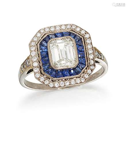 A diamond and sapphire cluster ring, the cut-cornered rectangular diamond centre to a calibre-cut