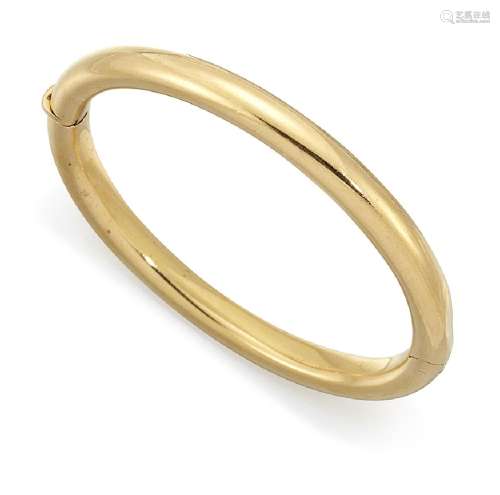 An 18ct gold bangle, of rounded form with hinged opening and push button clasp, European