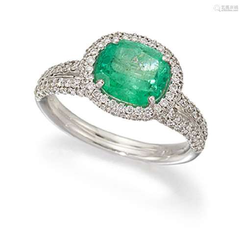 An emerald and diamond cluster ring, the cushion shaped emerald with brilliant-cut diamond twin