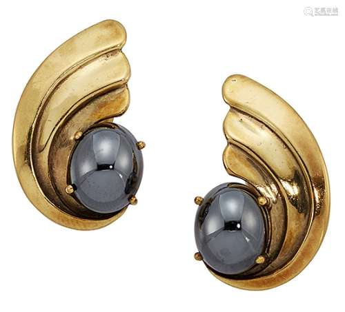 A pair of 9ct gold and hematite earclips by Deakin & Francis, each scroll motif panel with single