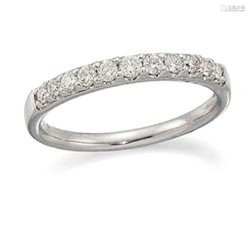 A diamond half-eternity ring, composed of a single row of brilliant-cut diamonds, ring size