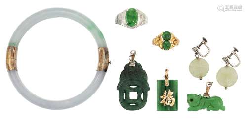 A group of treated jadeite jade jewellery, comprising: a bangle; a pair of carved jade and diamond