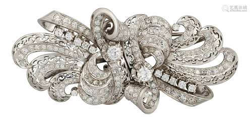 A diamond double clip brooch, of single-cut diamond opposed twin scrolling ribbon pierced panel