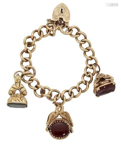 A 9ct gold charm bracelet, of curb-link design with 9ct gold padlock clasp suspending three fob